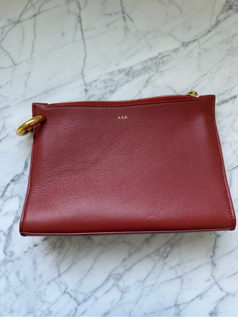 A.L.C. Terracotta colored Leather clutch with Gold Ring